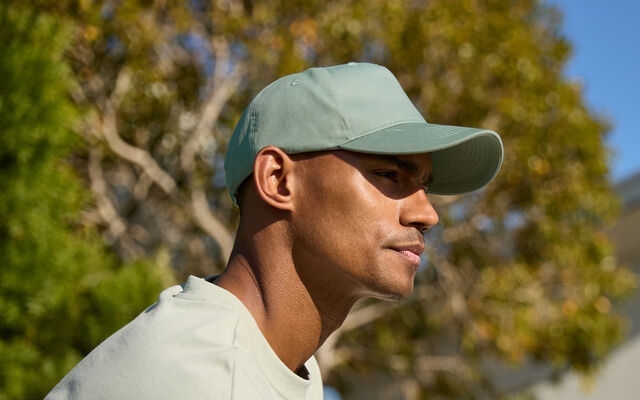 B62N EarthAware® Organic Cotton 5 Panel Cap in Dusty Green lifestyle shot