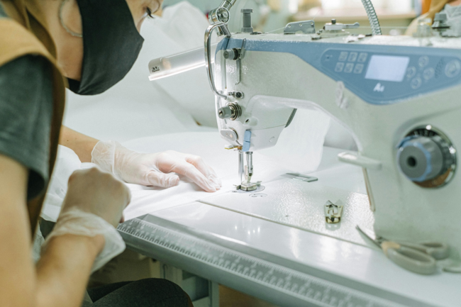 woman on a stitching machine
