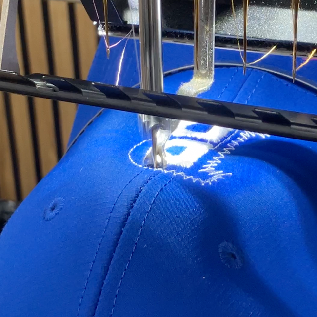 A Beechfield cap on an Embroidery Machine