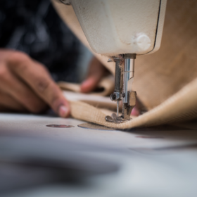 Close up of a bag being sewn together